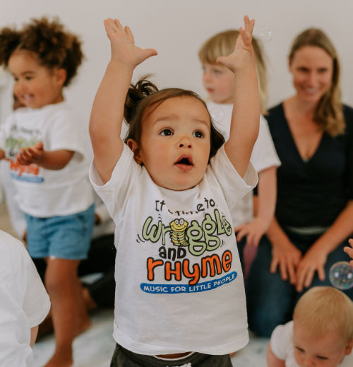 Toddler with hands in the air